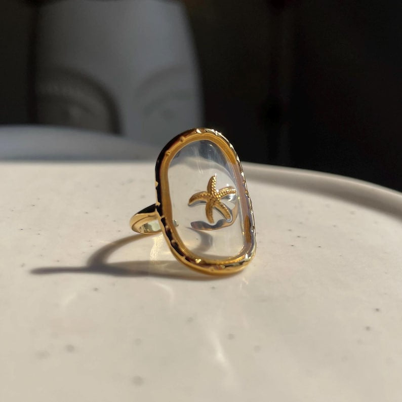 Bague réglable transparente étoile de mer doré en acier inoxydable