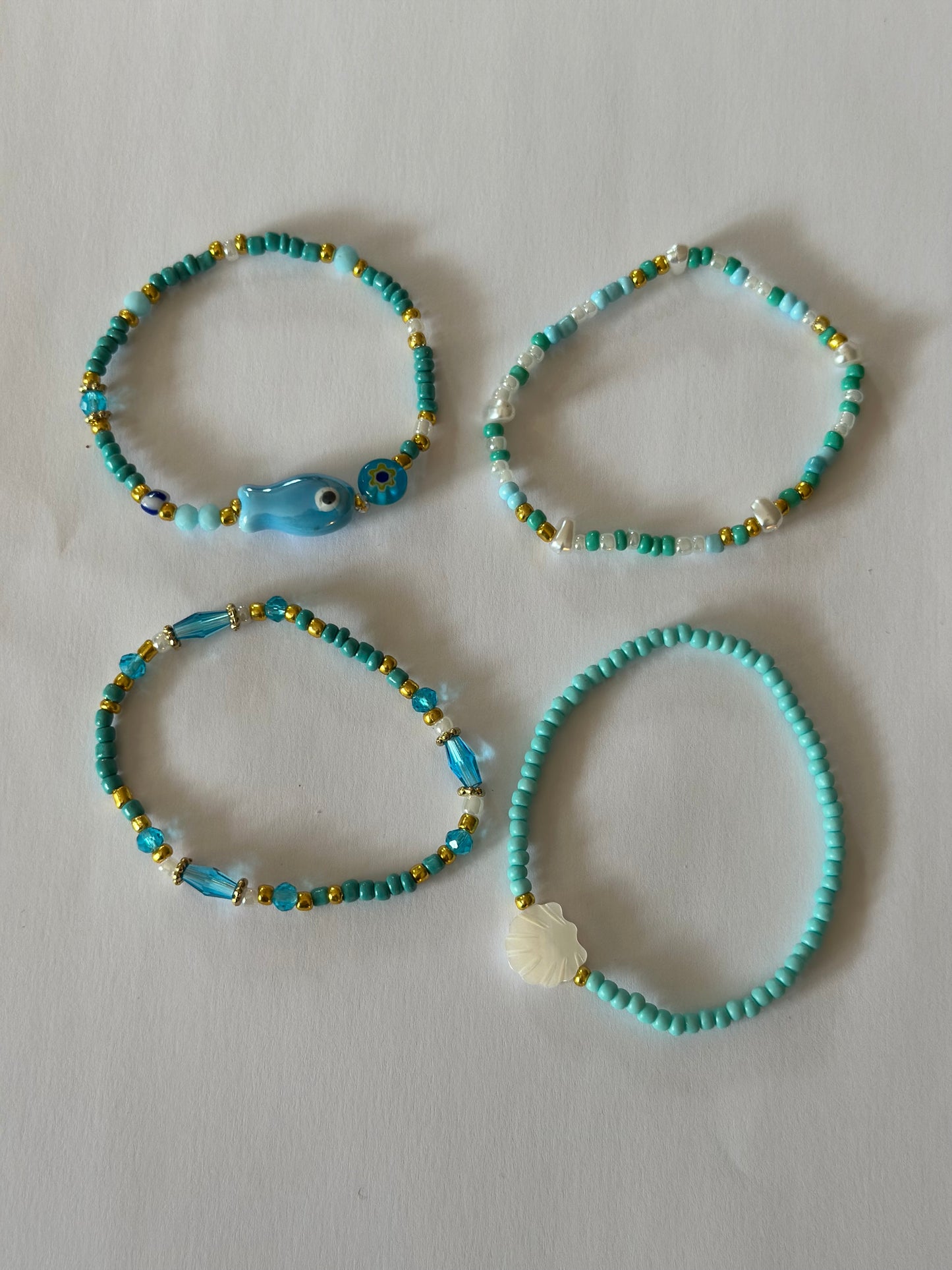 Lot de 4 bracelets perles bleu & doré, neufs