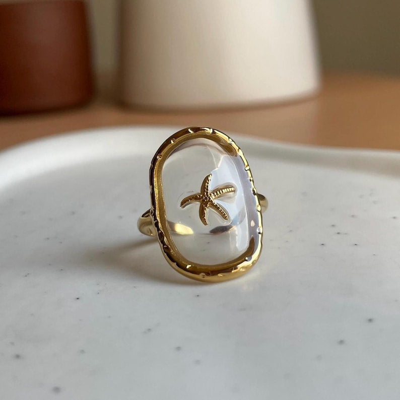Bague réglable transparente étoile de mer doré en acier inoxydable