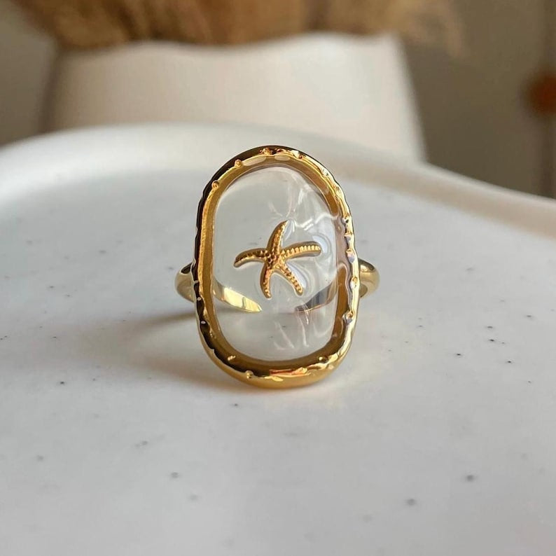 Bague réglable transparente étoile de mer doré en acier inoxydable
