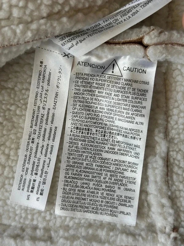 Veste sans manches style peau retournée beige et écru T.34