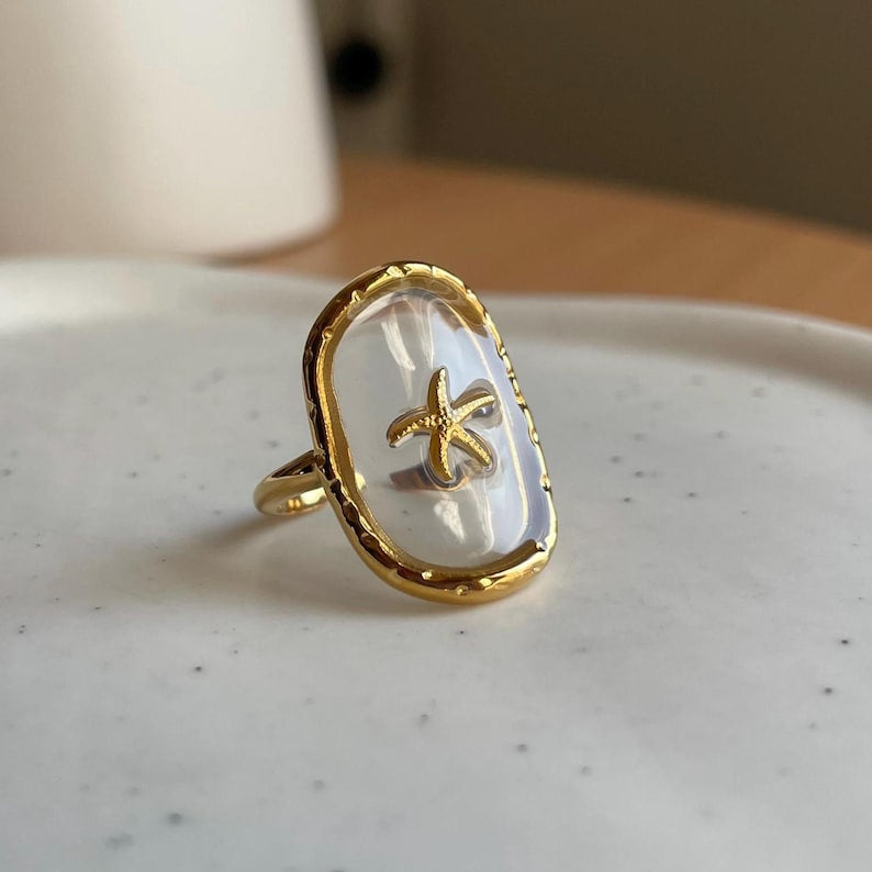 Bague réglable transparente étoile de mer doré en acier inoxydable