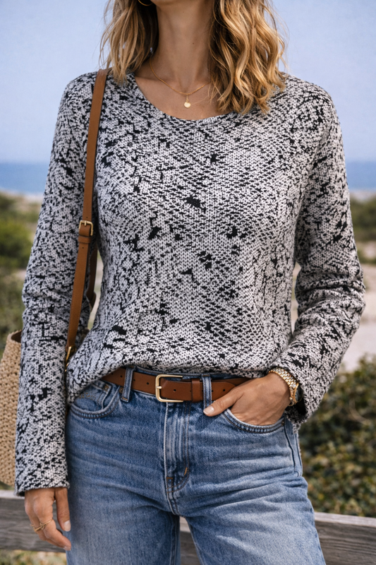 Pull imprimé abstrait noir et écru T.35