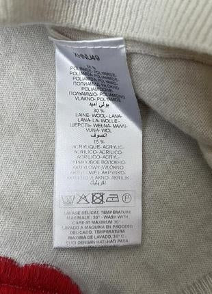 Pull en laine ivoire à motifs lèvres rouges T.34