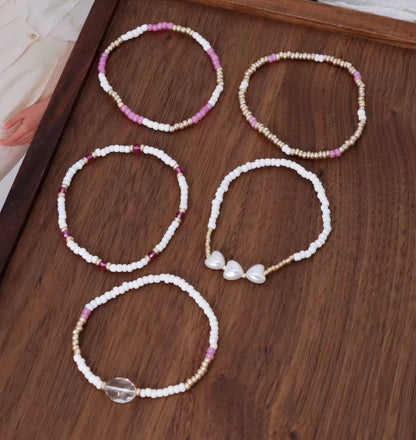 Lot de 5 bracelets perles – blanc, doré, rose – Neufs