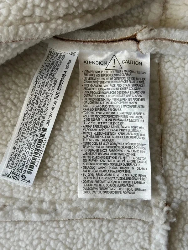 Veste sans manches style peau retournée beige et écru T.34