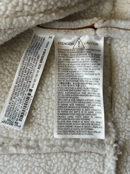 Veste sans manches style peau retournée beige et écru T.34
