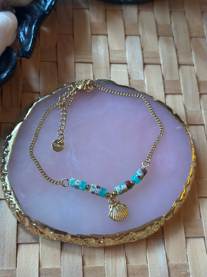 Bracelet neuf en acier inoxydable – Coquillage doré & perles bleues
